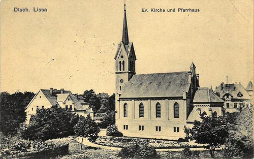 127. Dtsch. Lissa. Ev. Kirche und Pfarrhaus.